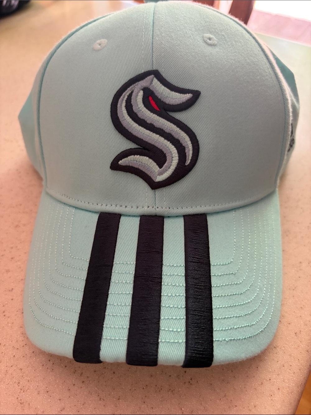 Seattle Kraken Baseball Cap Teal with navy Stripe Detail